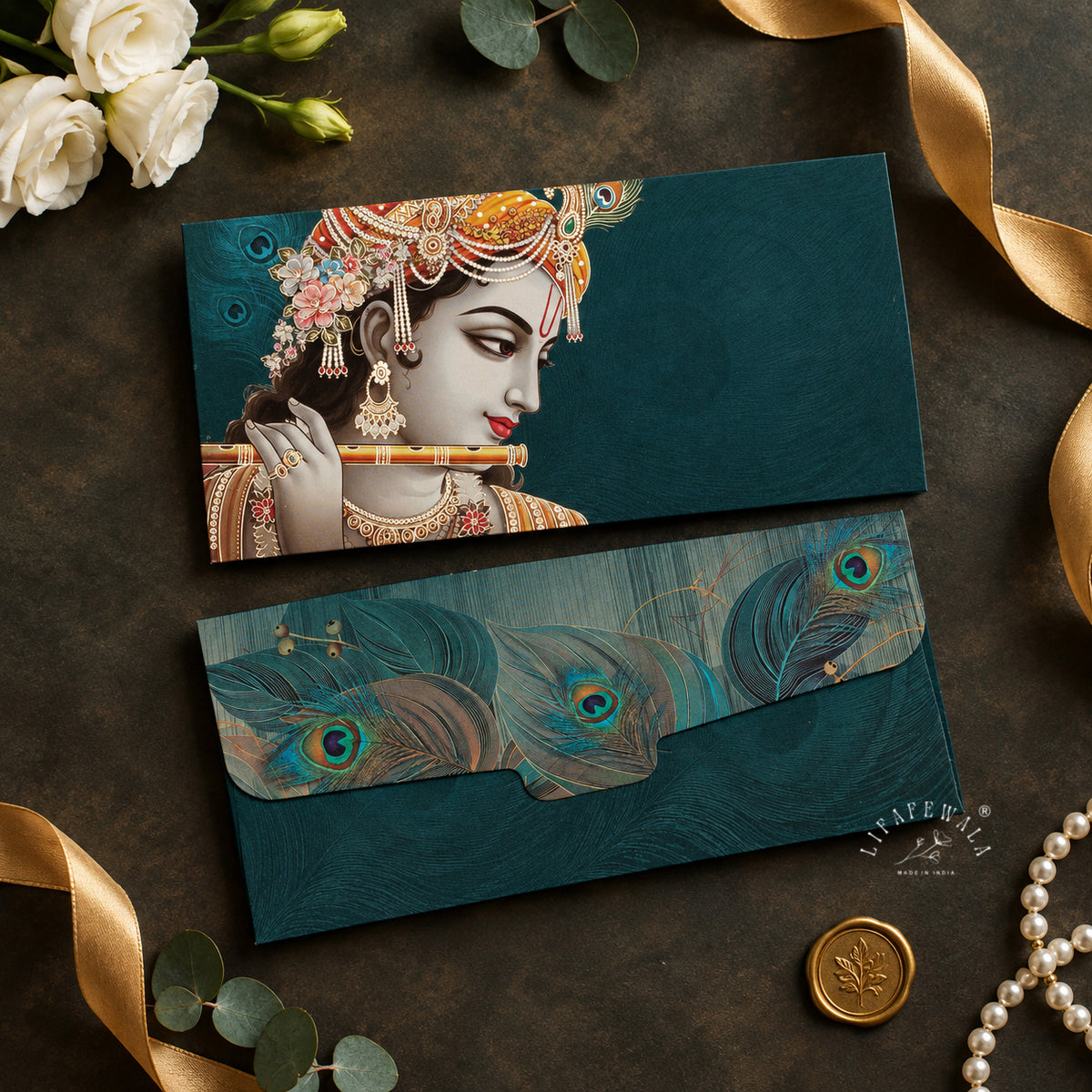 Krishna Flute and Peacock Feather velvet shagun envelope by LIFAFEWALA – styled flat lay