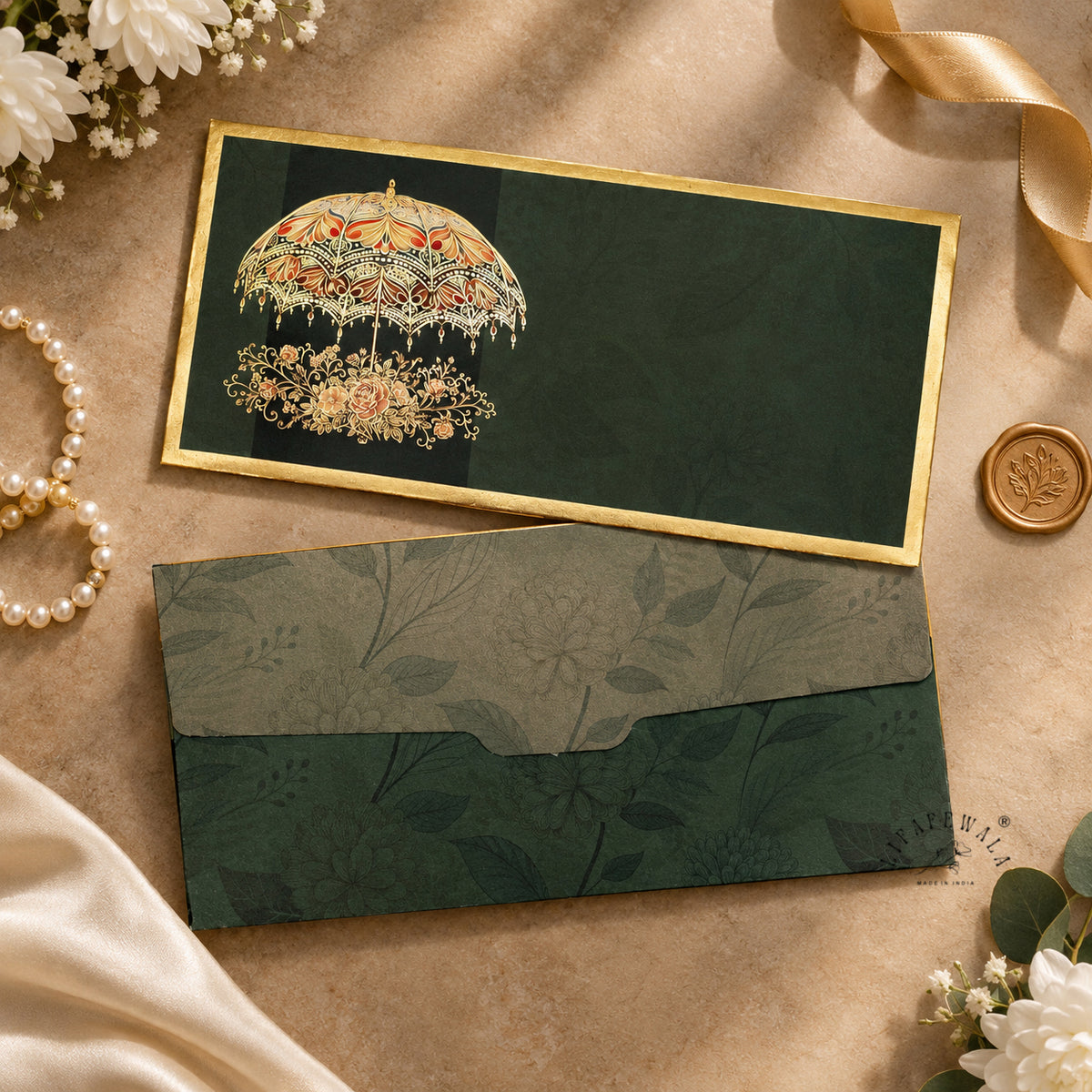 Emerald Golden Chhatri velvet shagun envelope by LIFAFEWALA – styled flat lay