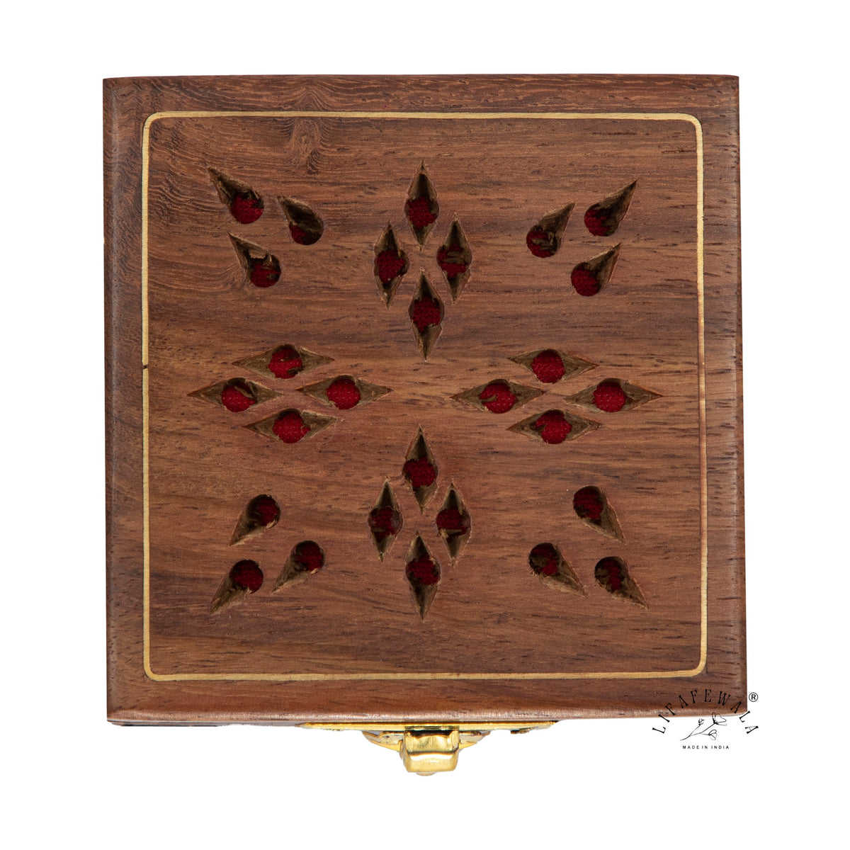 Top view of laser-cut star pattern wooden ginni box with brass inlay border